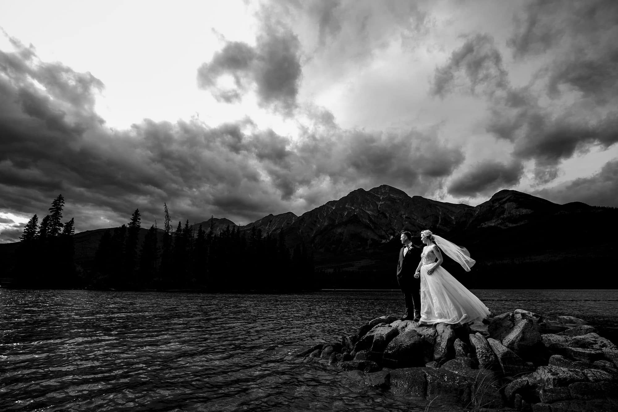 black and white image of bride and groom on Pyramid Lake