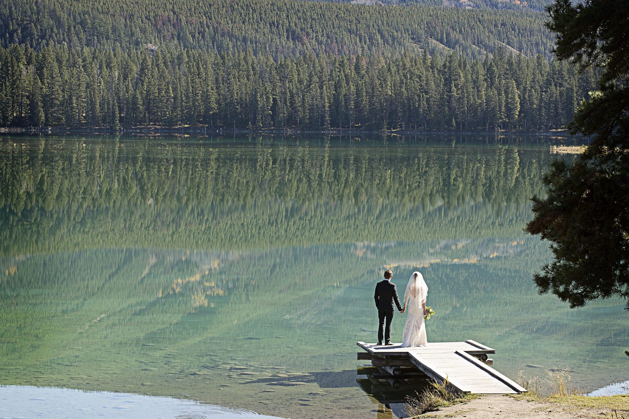couple looking out at the water in Jasper Alberta