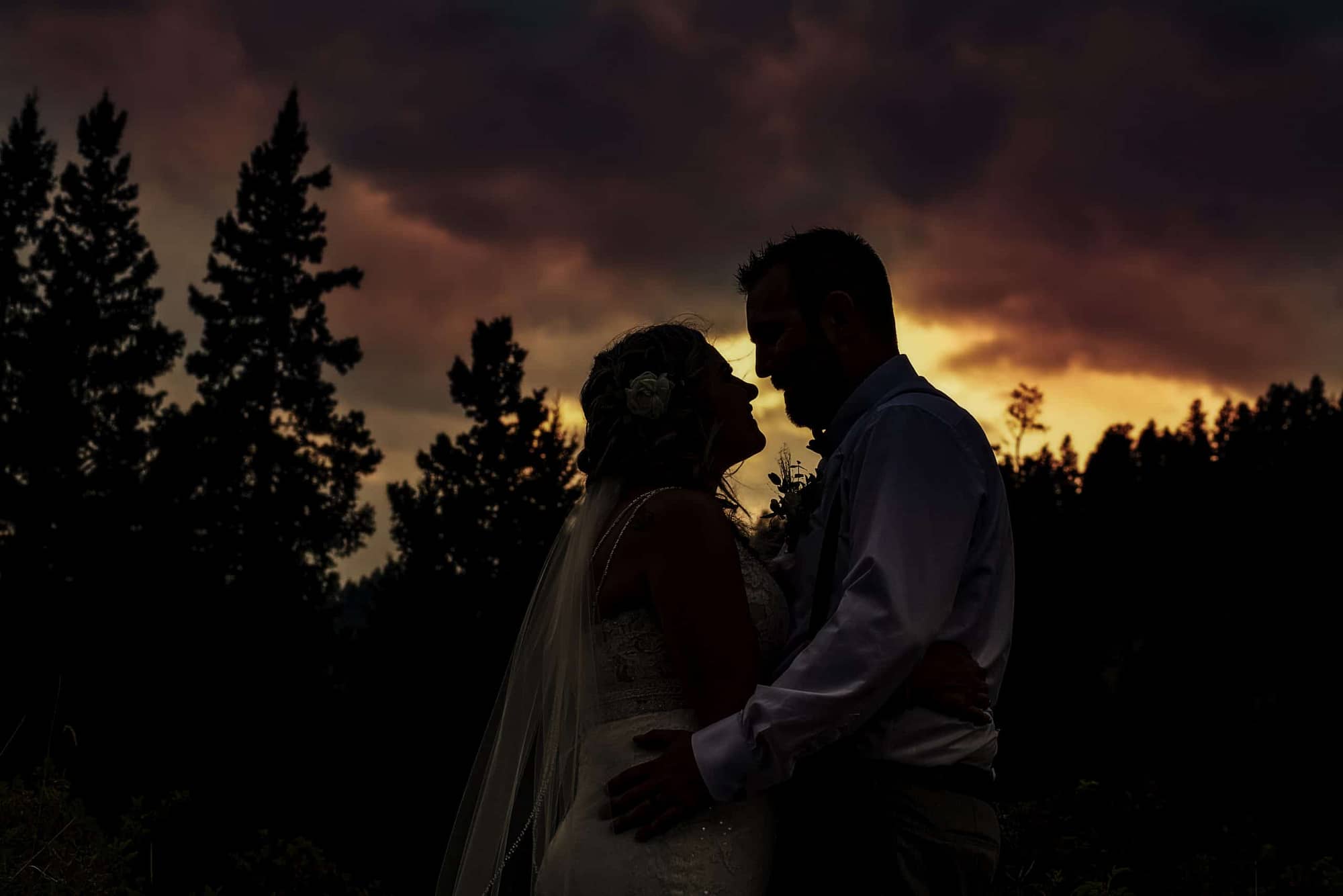 silhouette of wedding couple against sunset |Evening portraits at your wedding