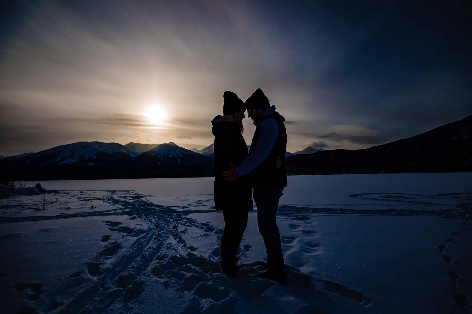 silhouetted couple on Pyramid Island in the winter| A Different Angle Photography